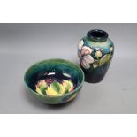 A Moorcroft leaf and berry bowl and a Clematis pattern vase, height 15cm