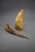 A 19th century scrimshaw sperm whale tooth and a horn handled lid