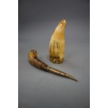 A 19th century scrimshaw sperm whale tooth and a horn handled lid