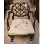 A painted and chinoiserie lacquered open armchair with pierced circular back and needlework seat,