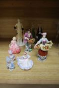 A group of Doulton, Coalport etc figures, two pin dolls and two biscuit wedding figures, tallest