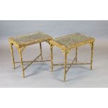 A pair of 20th century lacquered gilt faux bamboo occasional tables, inset with glazed, carved and