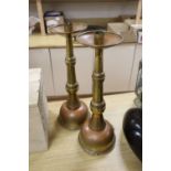 A pair of French brass ecclesiastical candlesticks, height 51cm