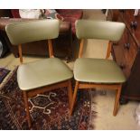 A set of four mid century dining chairs