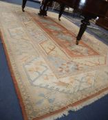 A Caucasian design geometric carpet, 380 x 263cmCONDITION: Generally faded and needs a thorough