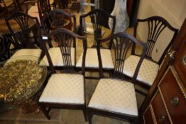 A set of six George III Hepplewhite-style dining chairs