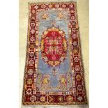 A Turkish rug, 184 x 92cm