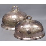 Two Victorian silver plated meat dish covers, largest 35 x 28cm