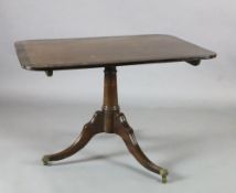 A Regency coromandel wood banded mahogany breakfast table, with rectangular tilt top, canon barrel