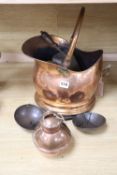 A copper coal, a pair of scales and a pair of 19th century brass pillar candlesticks
