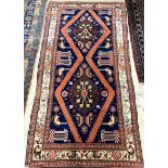 A Kurdish blue ground rug, 226 x 112cm