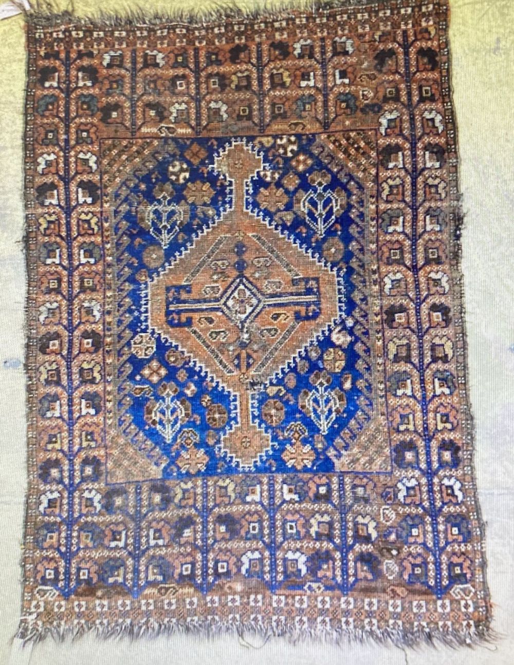 A Caucasian blue ground rug, 128 x 89cm, a Persian style red ground mat and a gold ground rug - Image 4 of 4