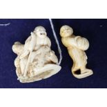 A 19th century Japanese ivory netsuke of Gama Sennin, unsigned, and a similar netsuke of a rakan,