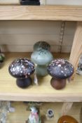 Boda, Sweden, two near pairs of glass mushrooms designed by Monica Backström, one brown/black ground