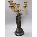 M. Moreau. A bronze and ormolu candelabrum, height 39cm