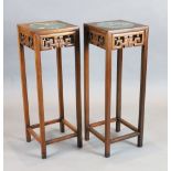 A pair of Chinese hardwood vase stands, each inset with cloisonne panels depicting birds on a branch