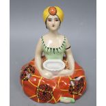 Henri Delcourt, Boulogne-Sur-Mer. A porcelain inkwell modelled as a figure of a genie, height 16cm