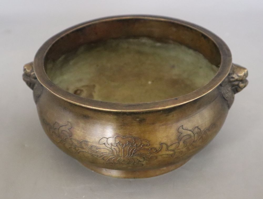 A Chinese bronze censer with lion mask handles, Xuande mark, but later, diameter 16cm