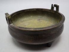 A Chinese bronze shallow tripod censer, Qianlong mark, late Qing, diameter 15cm, together with a