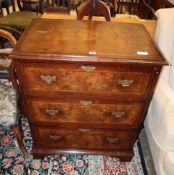 A George III style banded walnut chest of three long drawers, width 77cm, depth 50cm, height 92.5cm