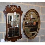 An oval painted and gilt-framed mirror and a mahogany wall mirror, larger width 57cm, height 83cm