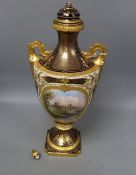 A large Coalport two handled vase and cover, painted with a scene of Balmoral Castle, height 50cm,