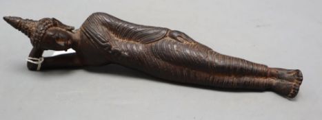 A 19th century Thai bronze reclining Buddha, length 28cm