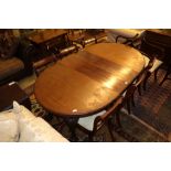A 1920's mahogany extending dining table with two leaves and winder, extends to 175cm