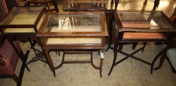 Three early 20th century display tables, largest 57cm