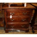 A 19th century style walnut chest with brushing slide and three drawers, Width 66cm