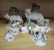 A pair of Derby sheep and a group of Staffordshire pottery animals, etc.