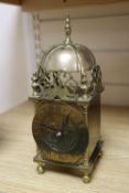 A mantel timepiece in the form of a brass lantern clock, height 26cm