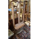 An oak artist's easel, width 60cm, depth 65cm, height approx. 277cm