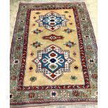 A Kazak yellow ground small carpet, 244 x 181cm