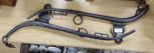 A pair of Victorian black painted wrought iron horse hames, length 82cm