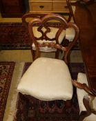 A set of four Victorian rosewood buckle back dining chairs, a.f. and a set of four mahogany