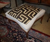 An Edwardian stool upholstered with an African fabric, width 67cm, depth 67cm, height approx. 45cm