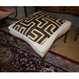 An Edwardian stool upholstered with an African fabric, width 67cm, depth 67cm, height approx. 45cm