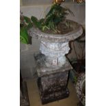 A reconstituted stone urn on plinth, height approx. 81cm, width approx. 41cm