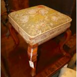 A Victorian mahogany dressing stool with needlework top