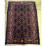 A Senneh blue ground rug, 152 x 99cm