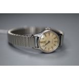 A lady's stainless steel Omega De Ville manual wind wrist watch, on associated strap.CONDITION: Dial