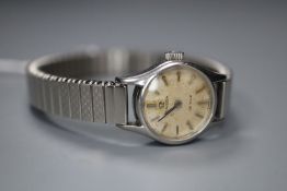 A lady's stainless steel Omega De Ville manual wind wrist watch, on associated strap.CONDITION: Dial