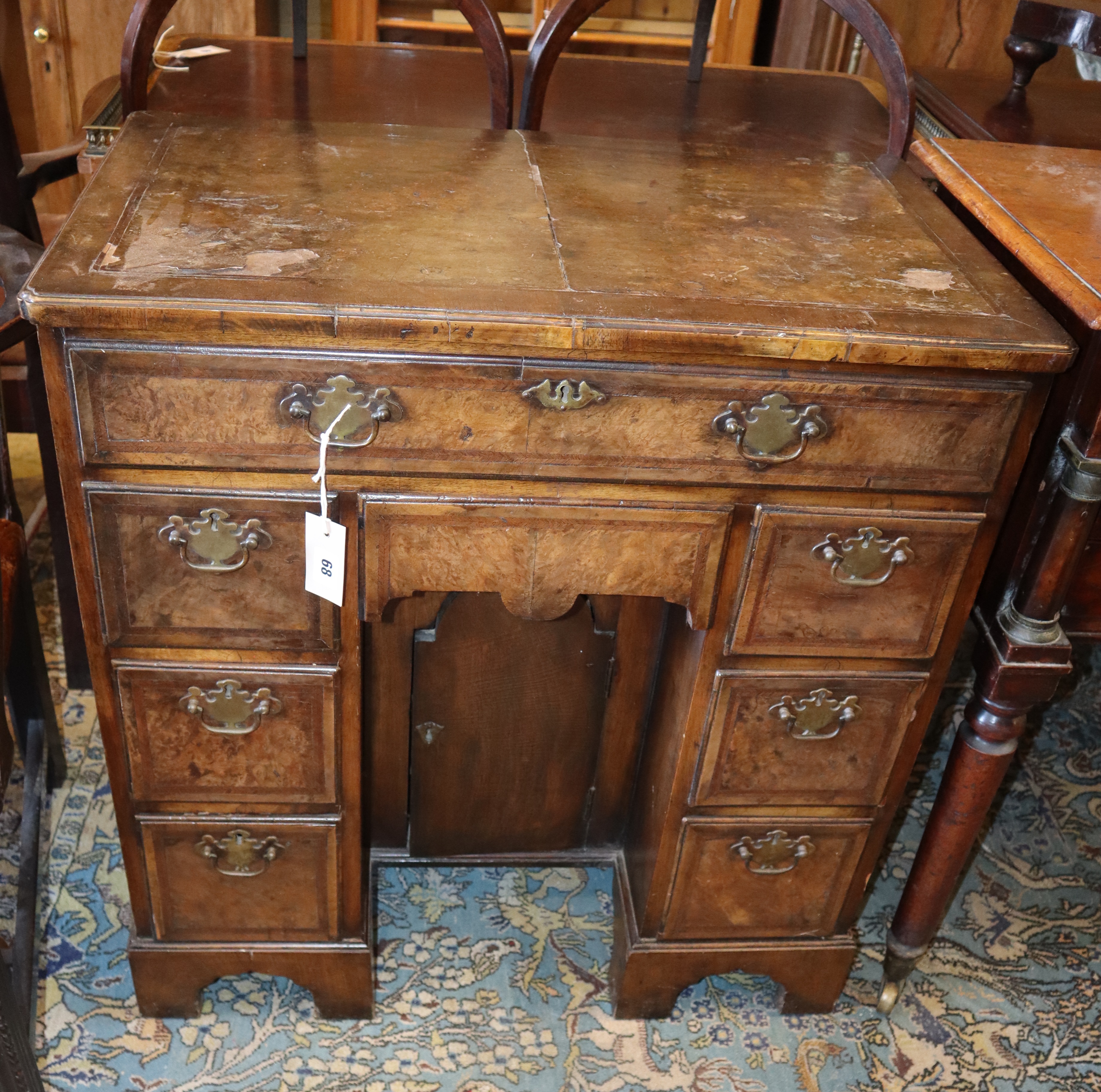 A George I style walnut kneehole desk, width 74cm depth 44cm, height 77cm