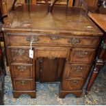 A George I style walnut kneehole desk, width 74cm depth 44cm, height 77cm