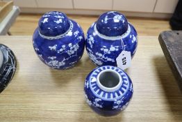 Three Chinese blue and white prunus jars and two covers