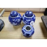 Three Chinese blue and white prunus jars and two covers