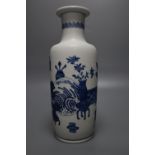 A Chinese blue and white rouleau vase, painted with domestic objects in underglaze blue, height