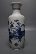 A Chinese blue and white rouleau vase, painted with domestic objects in underglaze blue, height