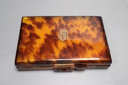 A 1930's tortoiseshell compact, 14cm